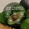 Avocado with text highlighting skin-friendly properties like no heavy metals or mineral oil free.