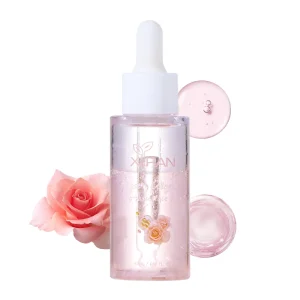 A bottle of Xifan rose collagen serum with a rose and gel drops.