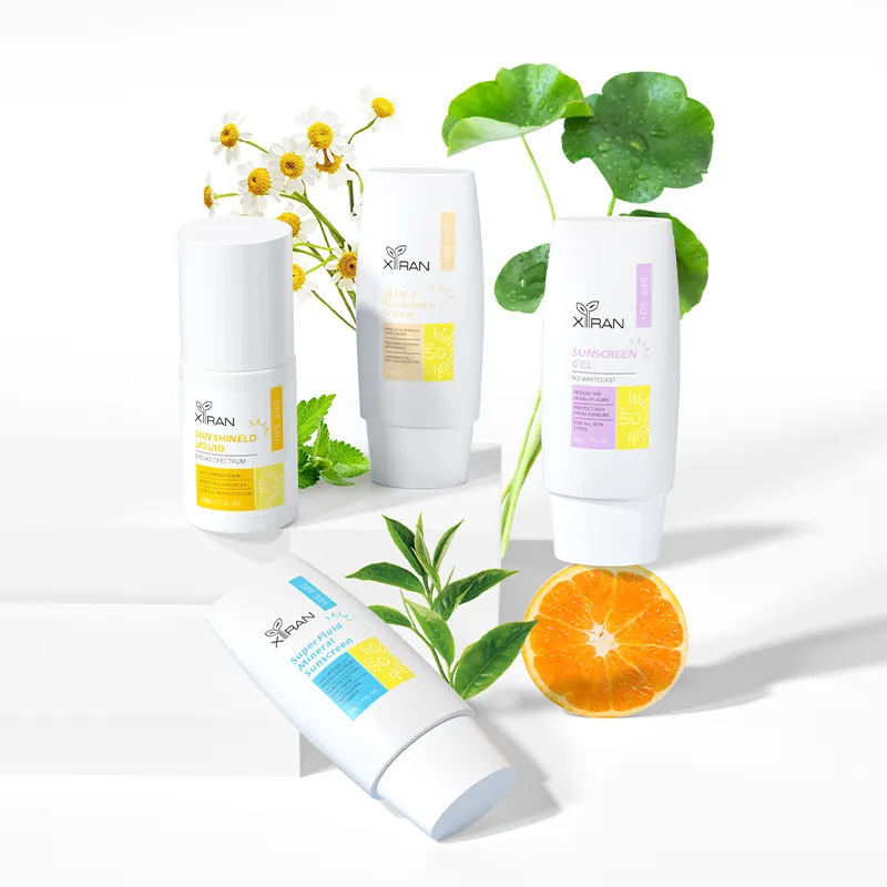 XIRAN sunscreen products with SPF 50, featuring a variety of containers surrounded by chamomile, orange, and green leaves.