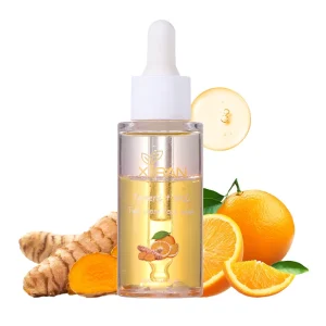 A bottle of Xiran Turmeric + Vit. C Two-Phase Base Serum surrounded by turmeric root and fresh oranges.