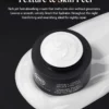 Black jar of Hydra-Firm Night Cream with smooth white cream on a decorative spill, featuring text about texture and benefits.