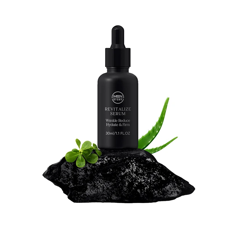 Men's revitalizing serum bottle with pipette, placed on dark rock with green aloe vera leaves and small plant, emphasizing natural ingredients.