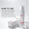 Bottle of post-procedure soothing repair mist with usage instructions displayed alongside its packaging on a clean surface.