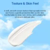Close-up of smooth cream texture on a blue sky background with descriptive text highlighting its gentle, non-sticky feel and suitability for children's skin.
