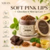 XIRAN chocolate and mint lip scrub jar with brown sugar granules, surrounded by ingredients like mint leaves, almonds, avocado, chocolate, and oil, promoting exfoliation and hydration.