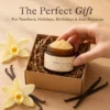 A jar labeled 'Xiran Vanilla Lip Scrub' in a gift box with decorative vanilla flowers and pods, presented on a wooden table.