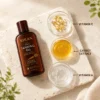 Xiran tanning oil bottle alongside bowls of vitamin E capsules, carrot extract, and vitamin A on a textured surface.
