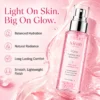 A hydrating glow revival mist bottle by Xiran Skincare on a pink background with text emphasizing balanced hydration, natural radiance, long-lasting comfort, and a smooth lightweight finish.