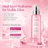 A pink dual-layer hydration mist bottle labeled Xiran PDRN Hydrating Glow Revival Mist, surrounded by water droplets and minimalistic elements.