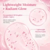 Close-up of a pink moisturizing essence with encapsulated oil droplets, showing its lightweight texture and benefits for radiant skin.